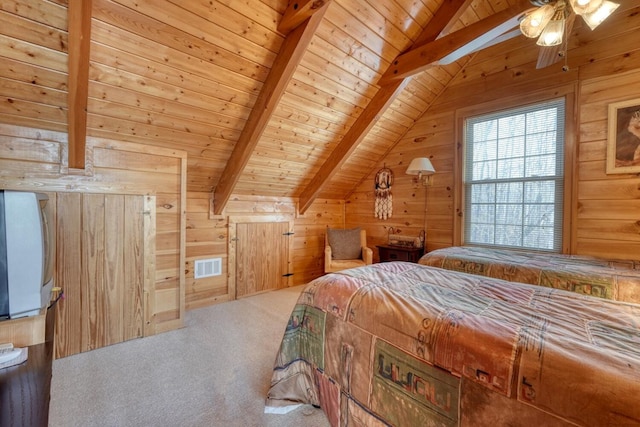 bedroom featuring lofted ceiling with beams, carpet floors, wood walls, and wooden ceiling