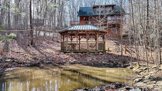 exterior space with a water view and a gazebo