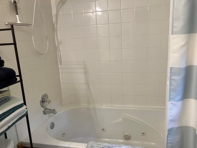 full bathroom featuring a combined bath / shower with jetted tub