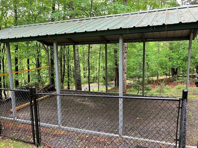 view of home's community with a gate and fence