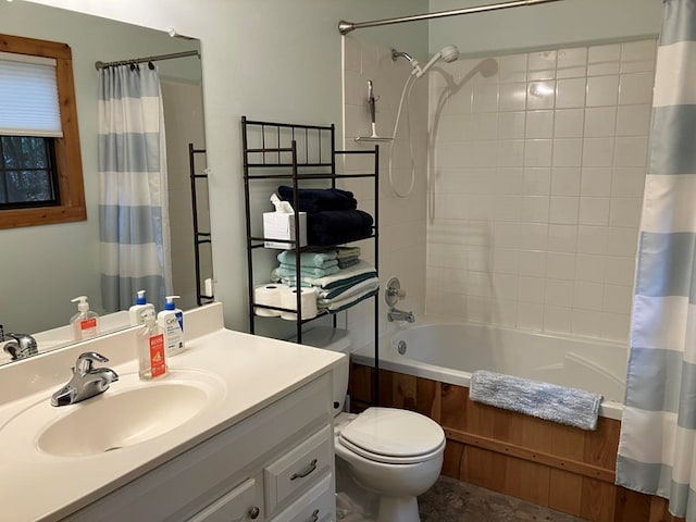bathroom with shower / bath combo with shower curtain, vanity, and toilet