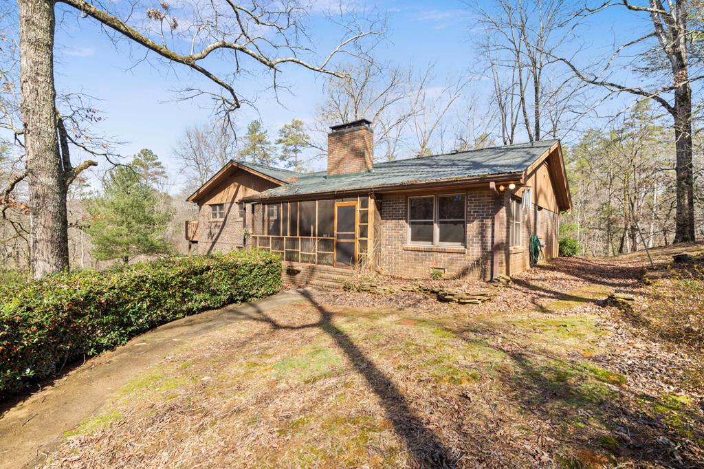 exterior space featuring a sunroom