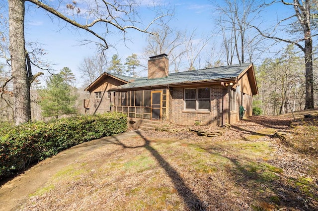 exterior space featuring a sunroom