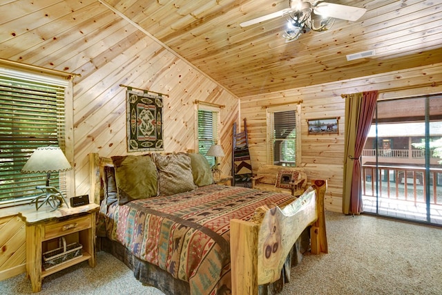 bedroom with wood walls, wood ceiling, carpet flooring, and ceiling fan