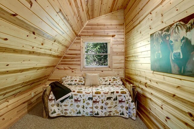 carpeted bedroom featuring wooden walls, lofted ceiling, and wooden ceiling