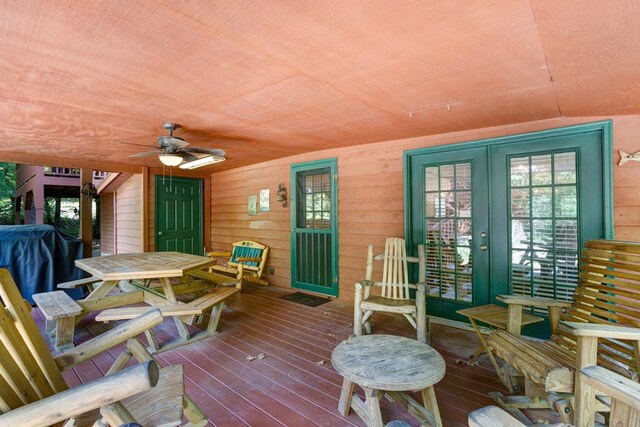 deck with ceiling fan and french doors