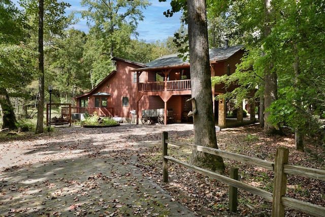 back of house with a wooden deck