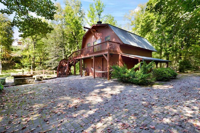 view of home's exterior featuring a deck