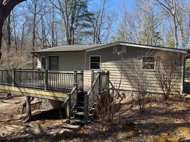 back of property with a wooden deck