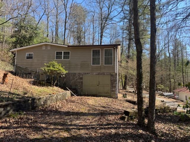 view of side of property with a garage