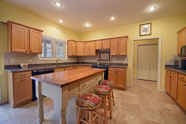 kitchen featuring wooden counters, backsplash, sink, black appliances, and light tile patterned floors