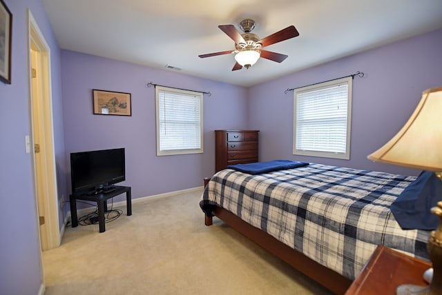 carpeted bedroom with ceiling fan