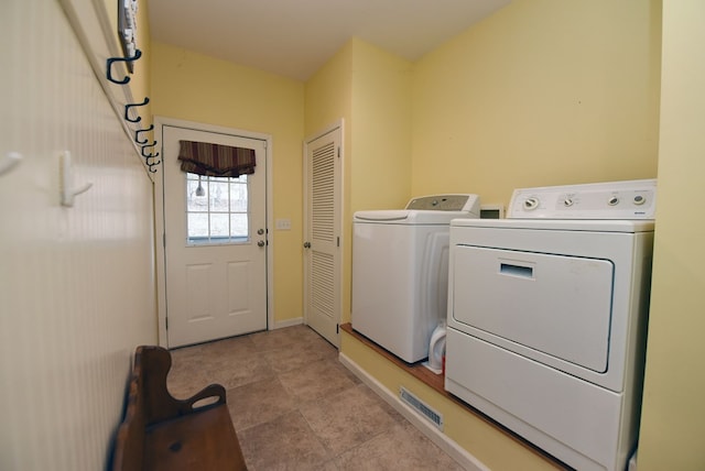 washroom with separate washer and dryer