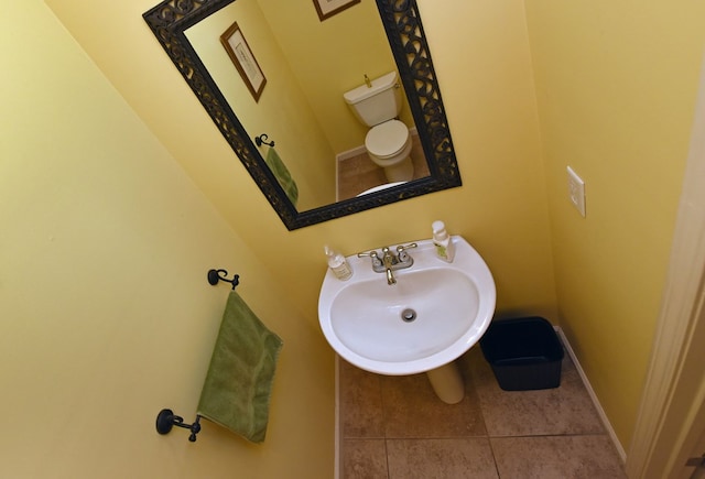 bathroom featuring tile patterned floors, sink, and toilet