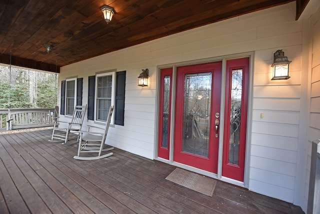 property entrance featuring a porch