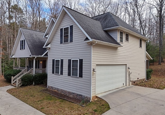 view of front of house with a porch and a garage