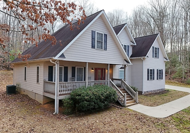 view of front of home with covered porch and central AC