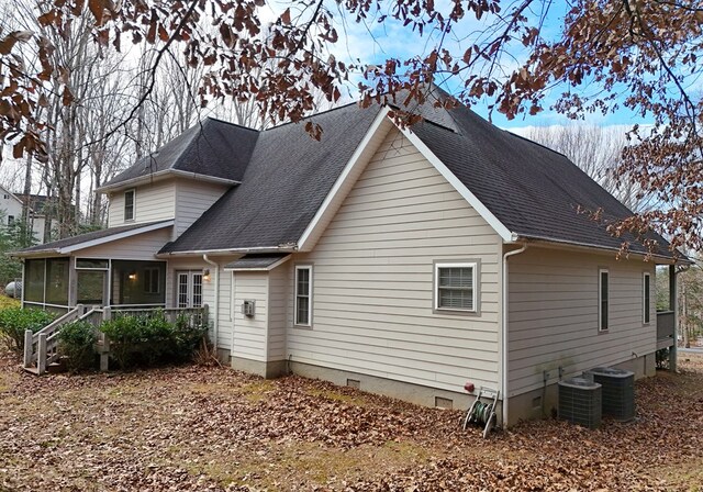 back of house with a sunroom and central air condition unit