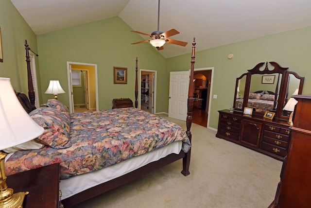 carpeted bedroom featuring a closet, a spacious closet, ceiling fan, and lofted ceiling