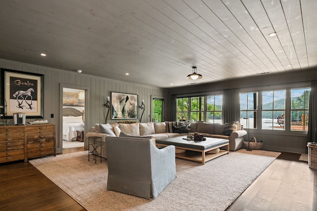 living area featuring hardwood / wood-style floors, recessed lighting, and wood ceiling