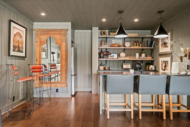 bar featuring recessed lighting, wooden ceiling, freestanding refrigerator, wood finished floors, and hanging light fixtures