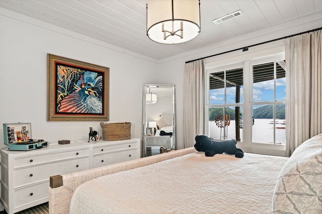 bedroom with an inviting chandelier, wood ceiling, and visible vents