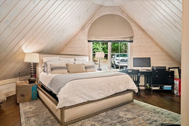 bedroom with wood finished floors, wood walls, and vaulted ceiling