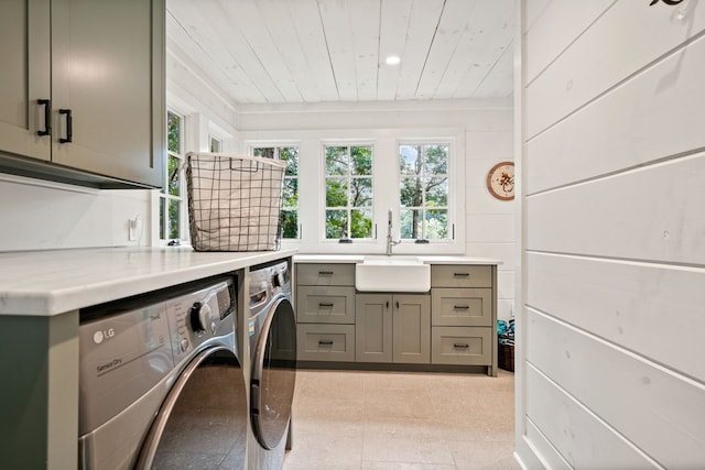 washroom with washing machine and clothes dryer, recessed lighting, cabinet space, a sink, and wooden ceiling