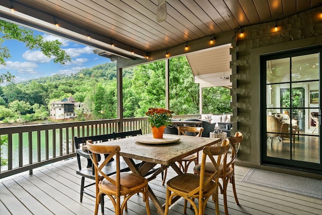 wooden deck with outdoor dining area