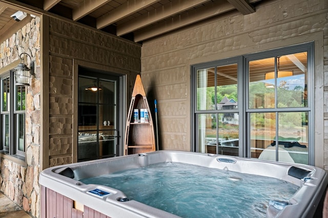 view of patio / terrace featuring a hot tub