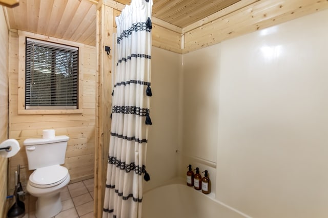 bathroom featuring wooden walls, wooden ceiling, tile patterned floors, toilet, and shower / bath combo with shower curtain