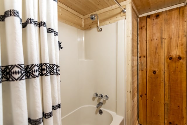 bathroom with shower / bath combination with curtain and wooden ceiling