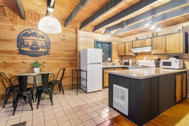 kitchen featuring wood ceiling, white appliances, wooden walls, decorative light fixtures, and beamed ceiling