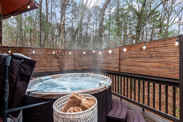 deck with a hot tub