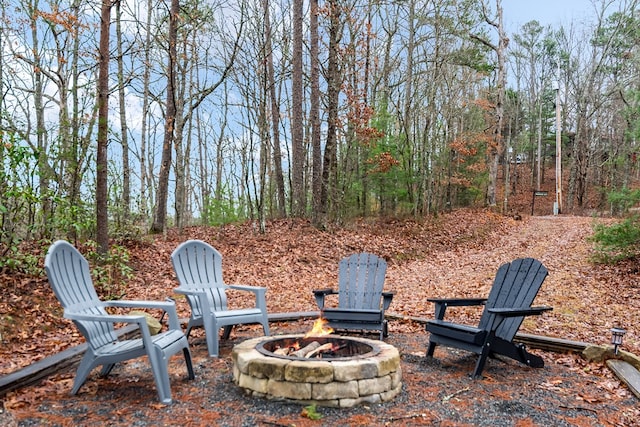 view of yard with an outdoor fire pit