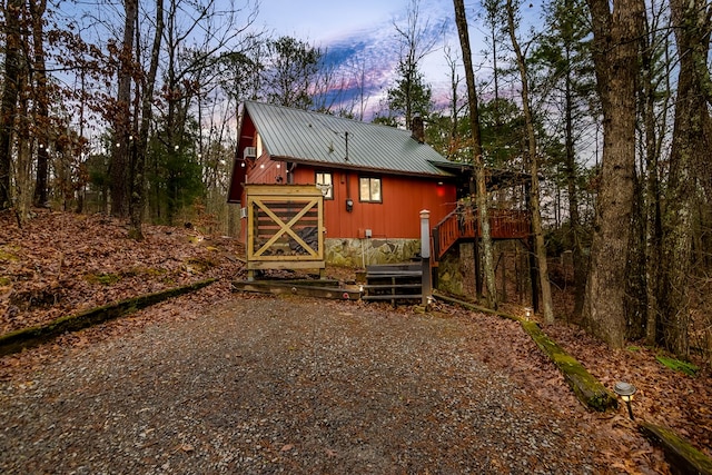 view of back house at dusk