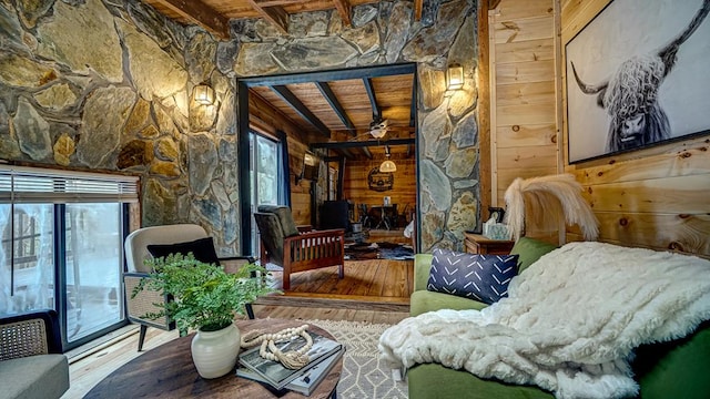 sitting room featuring wood-type flooring, a wealth of natural light, and wooden ceiling