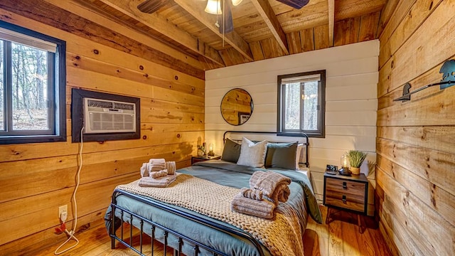 bedroom with a wall mounted air conditioner, wooden walls, hardwood / wood-style floors, and wooden ceiling