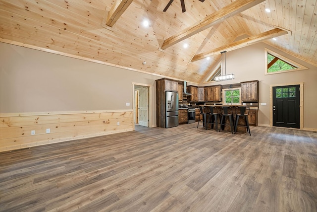 241 Lemmon Ln, Ellijay, GA 30540 - kitchen featuring stainless steel appliances, open floor plan, a wood ceiling with exposed beams, a breakfast bar, and high vaulted ceiling