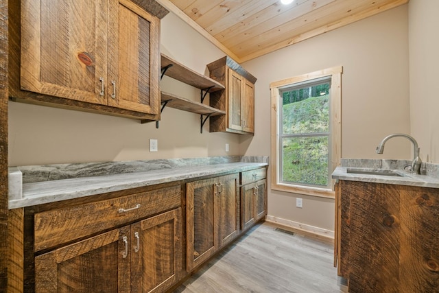 241 Lemmon Ln, Ellijay, GA 30540 - kitchen featuring light wood-style flooring, open shelves, brown cabinetry, wood ceiling, and light stone countertops