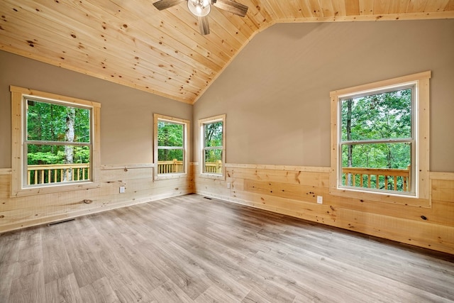 241 Lemmon Ln, Ellijay, GA 30540 - empty room featuring a wainscoted wall, lofted ceiling, wood ceiling, wooden walls, and healthy amount of natural light