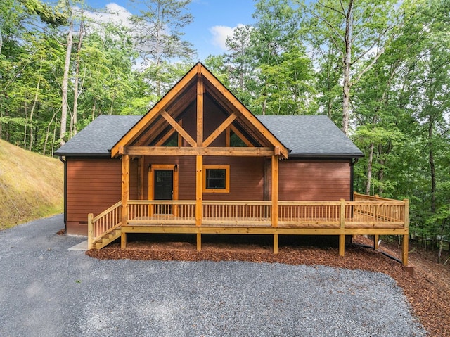 241 Lemmon Ln, Ellijay, GA 30540 - chalet / cabin with roof with shingles, covered porch, and view of scattered trees