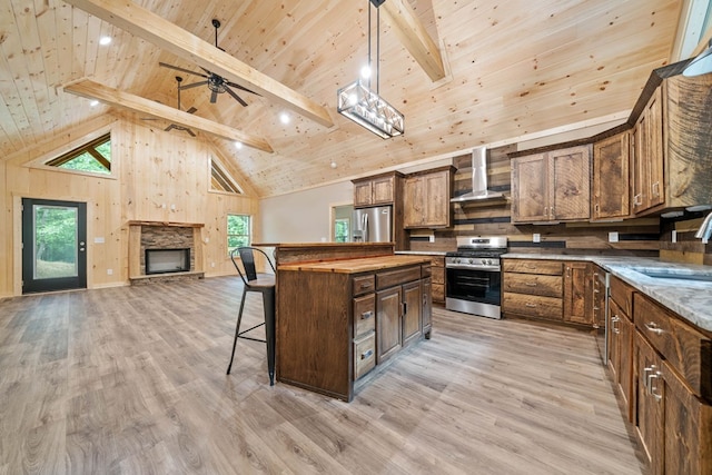241 Lemmon Ln, Ellijay, GA 30540 - kitchen featuring appliances with stainless steel finishes, a wood ceiling with exposed beams, wall chimney range hood, a breakfast bar, and light wood-style flooring