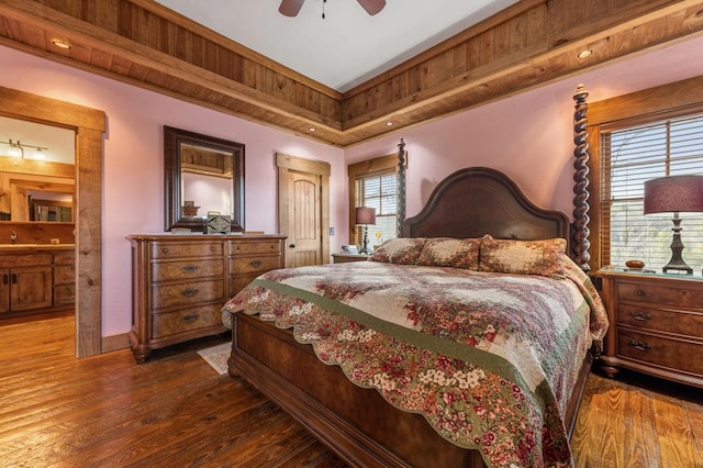 bedroom featuring multiple windows, ceiling fan, and dark hardwood / wood-style floors