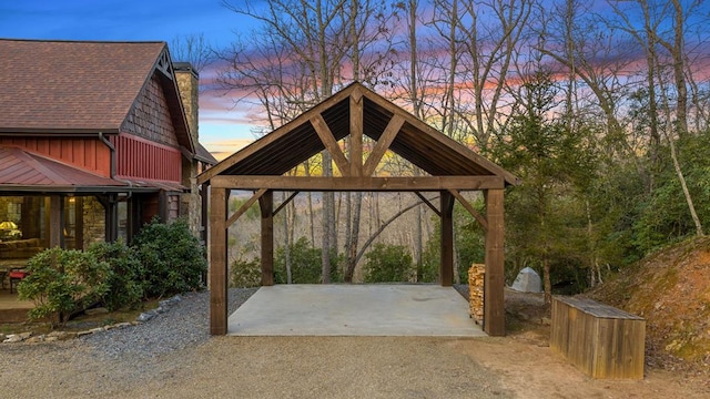 view of patio / terrace featuring a gazebo, driveway, and a carport