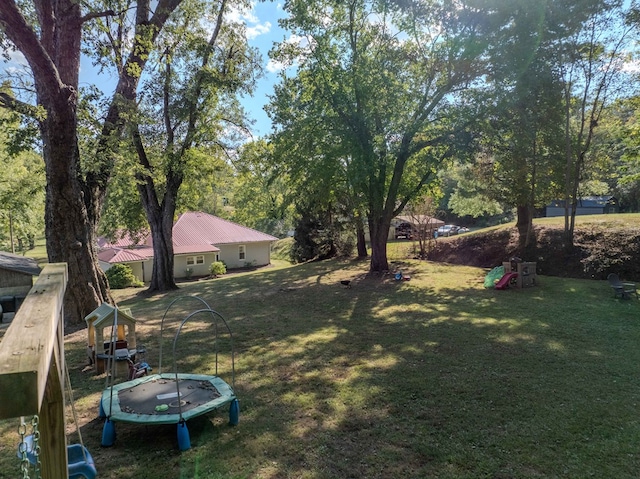 view of yard with a trampoline