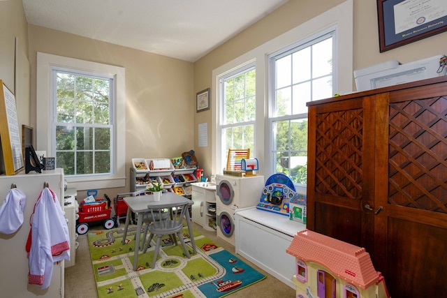 recreation room with plenty of natural light and carpet flooring