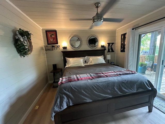 bedroom featuring wood-type flooring, access to exterior, and ceiling fan