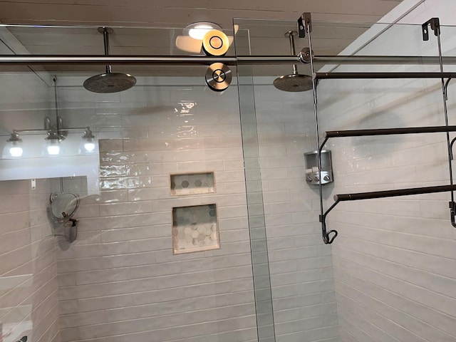 bathroom with a shower with shower door