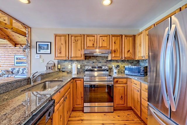 444 Wild Turkey, Tiger, GA 30576 - kitchen featuring exhaust hood, appliances with stainless steel finishes, a sink, light stone counters, and light wood finished floors